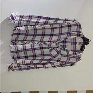 Flannel checkered shirt in white, pink, and blue.